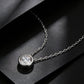 Perspective view of 1CT round bezel solitaire floating diamond pendant on black display.