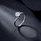 Model hands crossed close-up showing 1ct round diamond bypass solitaire engagement ring.
