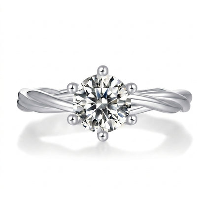 1ct round cut moissanite engagement ring with 6-prong setting and plain twisted vine band on white background.
