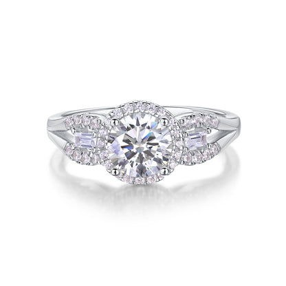 1CT round cut moissanite halo engagement ring with baguette side stones and split pave shank on white background.