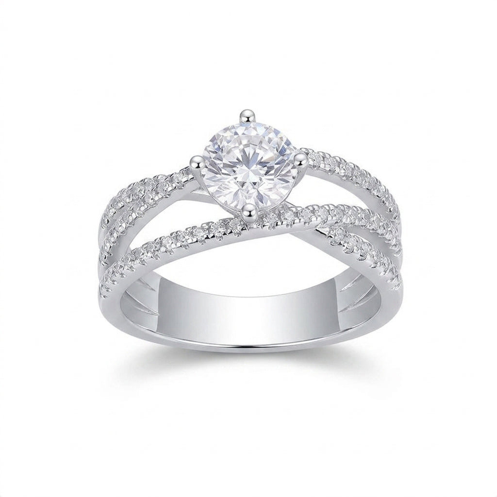 1ct round cut moissanite crossover engagement ring with criss cross pave band on white background.