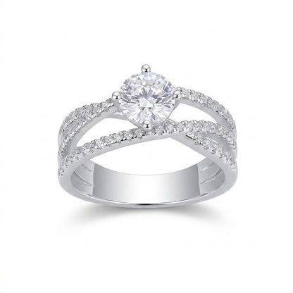1ct round cut moissanite crossover engagement ring with criss cross pave band on white background.