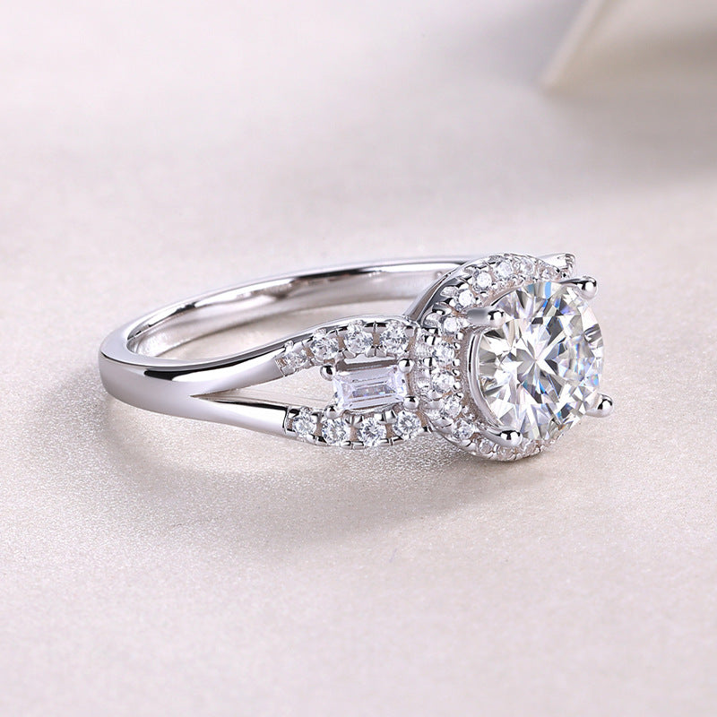 Side profile view showing split shank and halo setting on silver round moissanite ring.