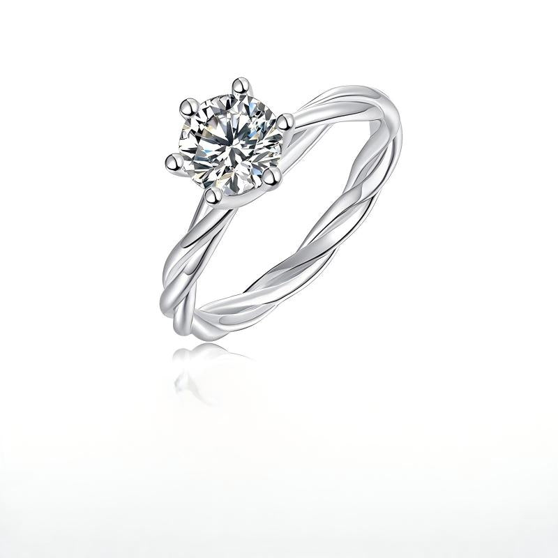 Silver 1ct round moissanite ring with twisted vine rope band standing on display.