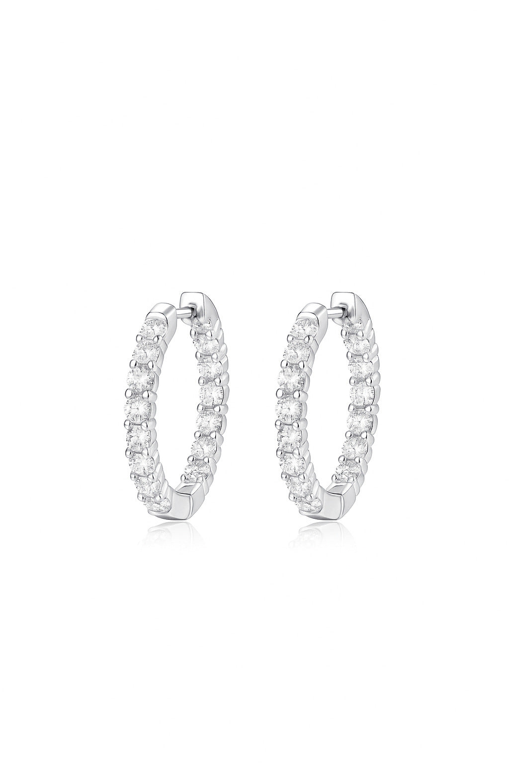 Yellow gold 2.1 CT round studs on neutral background. Alt: “2.1 CT Round Moissanite Earrings – 18K Yellow Gold.”