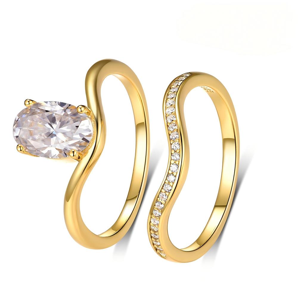 Yellow gold 2.5ct oval stacking set on neutral background. Alt: “2.50ct Egg Shape Diamond Stacking Set – 18K Yellow Gold.”