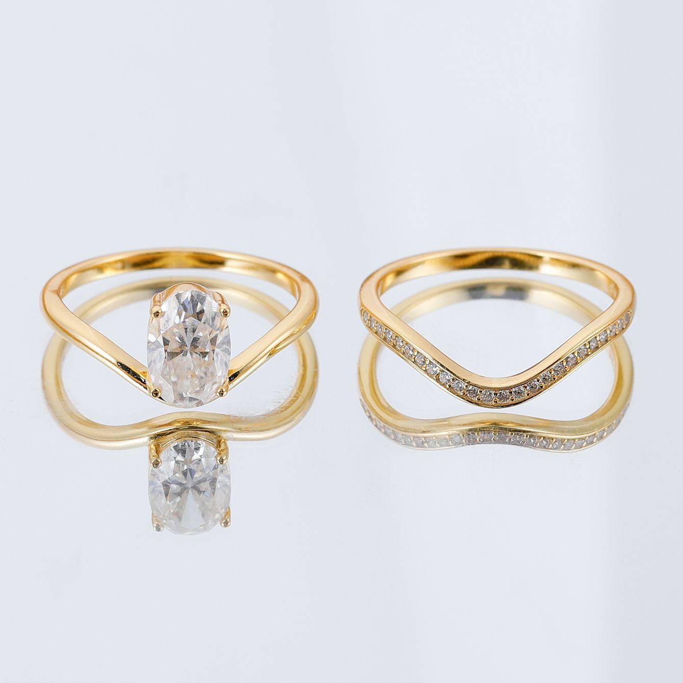 Yellow gold 2.5ct oval stacking set on neutral background. Alt: “2.50ct Egg Shape Diamond Stacking Set – 18K Yellow Gold.”