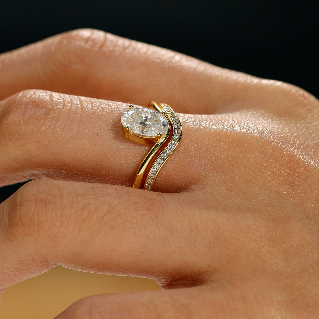 Set worn as double-stacked wedding rings. Alt: “Organic Elegance: Oval Diamond Bridal Set.”