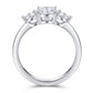 Side view profile of 2.5ct oval moissanite three-stone ring with polished platinum-plated band.
