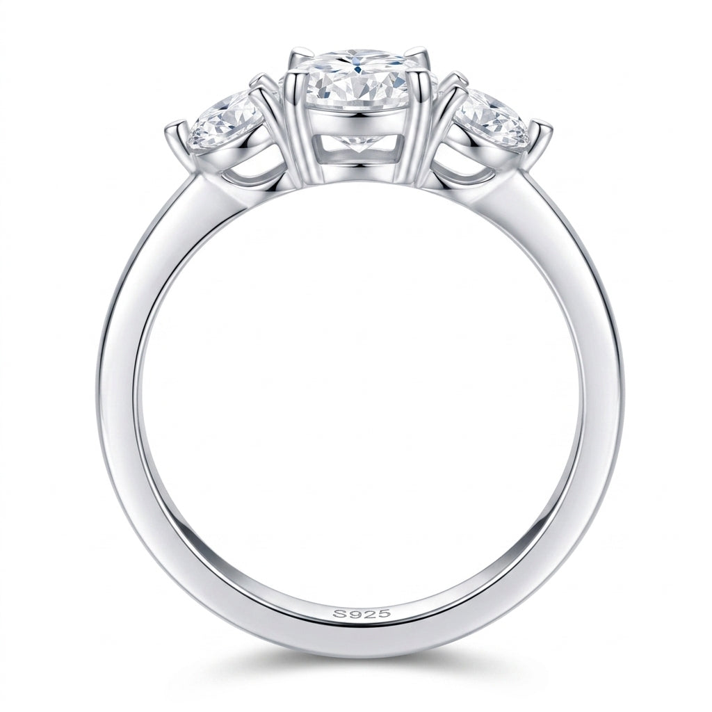 Side view profile of 2.5ct oval moissanite three-stone ring with polished platinum-plated band.