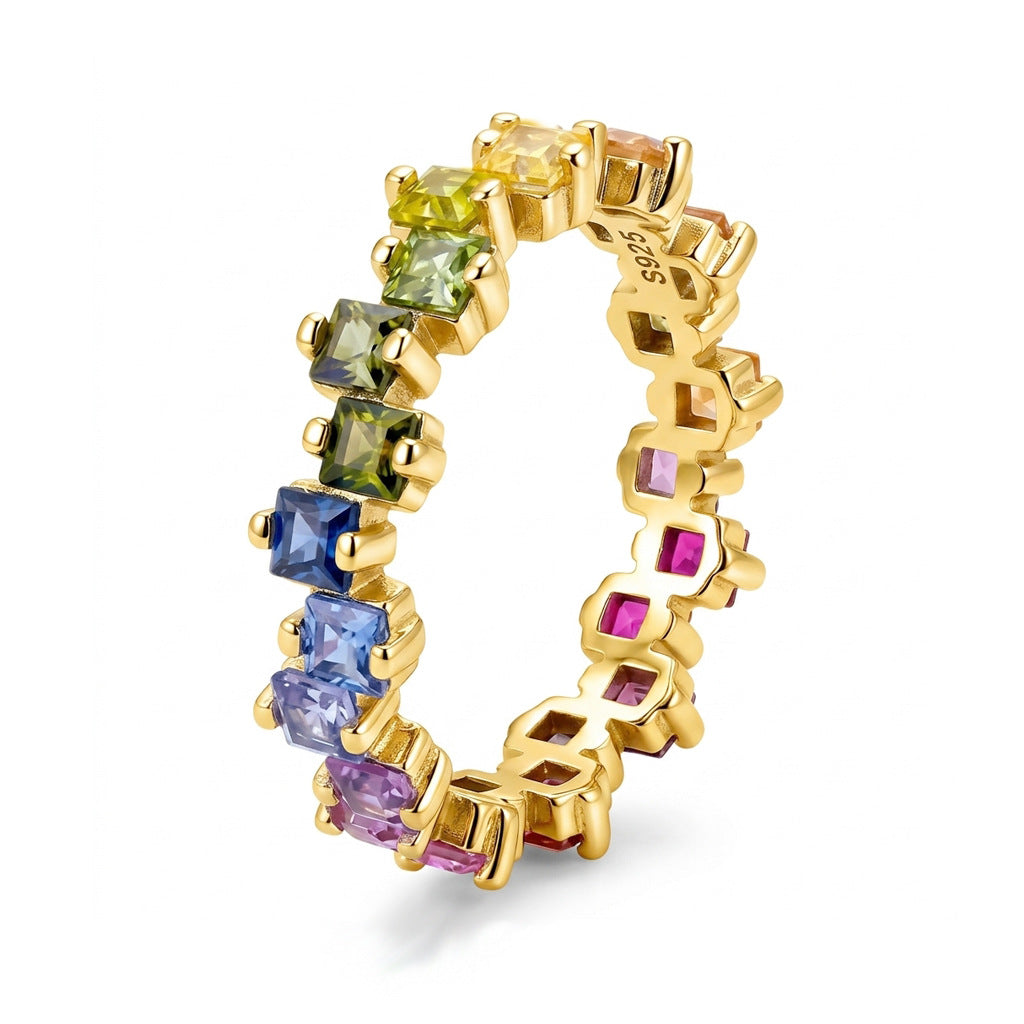 Gold 2.5mm princess cut rainbow gradient gemstone eternity band ring isolated on white background