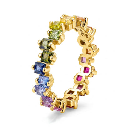 Gold 2.5mm princess cut rainbow gradient gemstone eternity band ring isolated on white background