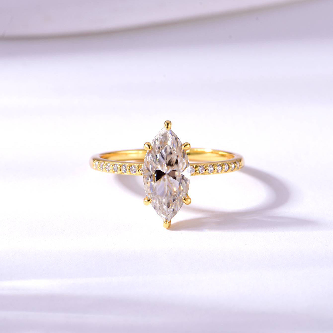  Yellow gold 2CT marquise solitaire on neutral background. Alt: “2CT Marquise Moissanite Solitaire – 18K Yellow Gold.”
