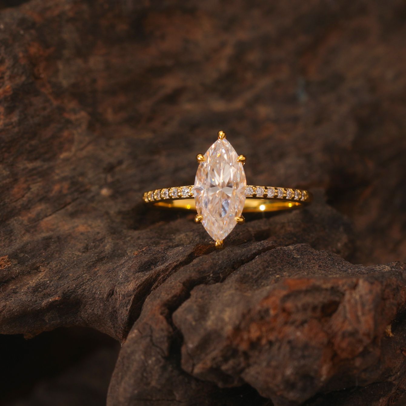  Yellow gold 2CT marquise solitaire on neutral background. Alt: “2CT Marquise Moissanite Solitaire – 18K Yellow Gold.”