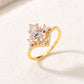 Yellow gold 2CT pear moissanite ring on soft romantic background. Alt: “2CT Water Drop Moissanite Engagement Ring – 18K Yellow Gold.”
