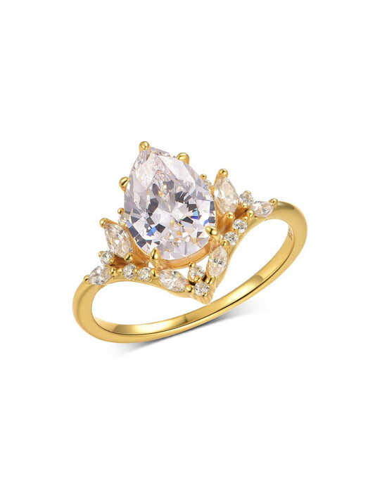 Yellow gold 2CT pear moissanite ring on soft romantic background. Alt: “2CT Water Drop Moissanite Engagement Ring – 18K Yellow Gold.”