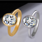 Gold and silver rings with large gemstones on a gradient background