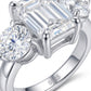 Macro view showing 4-prong basket setting, round side stones, and S925 hallmark on emerald cut moissanite ring.