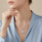 Model wearing 2ct round moissanite square cushion halo pendant necklace.