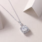 Close-up view of 2ct round moissanite square cushion halo pendant on chain.