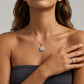 Close-up of model wearing 2ct moissanite square cushion halo pendant on collarbone.