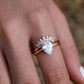  Set worn as double-stacked wedding rings. Alt: “Romantic Silhouette: Pear Cut Diamond Bridal Set.”