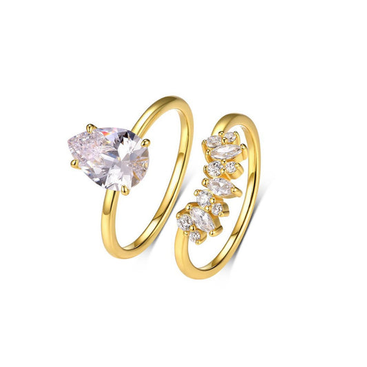 Yellow gold 2ct pear stacking set on neutral background. Alt: “2ct Drop Shape Diamond Stacking Set – 18K Yellow Gold.”