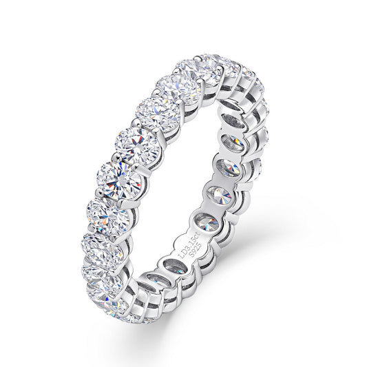3.15 ctw oval cut lab grown diamond eternity ring in sterling silver isolated on white background