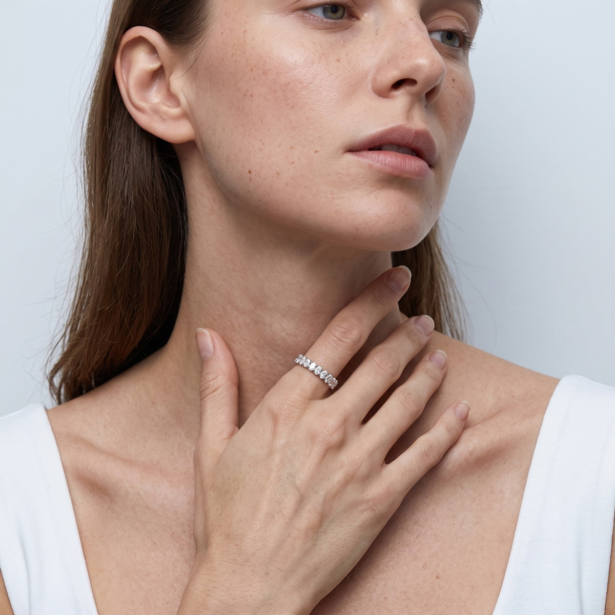 Model wearing 3.15 ctw oval cut lab grown diamond eternity ring on finger
