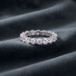 Perspective shot of 3.54ct round cut lab grown diamond full eternity band on dark silk.
