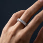 Close up of woman wearing 3.88 ctw asscher cut lab grown diamond eternity ring on hand
