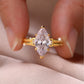 Yellow gold 3CT marquise moissanite ring on soft romantic background. Alt: “3CT Marquise Moissanite Engagement Ring – 18K Yellow Gold.”
