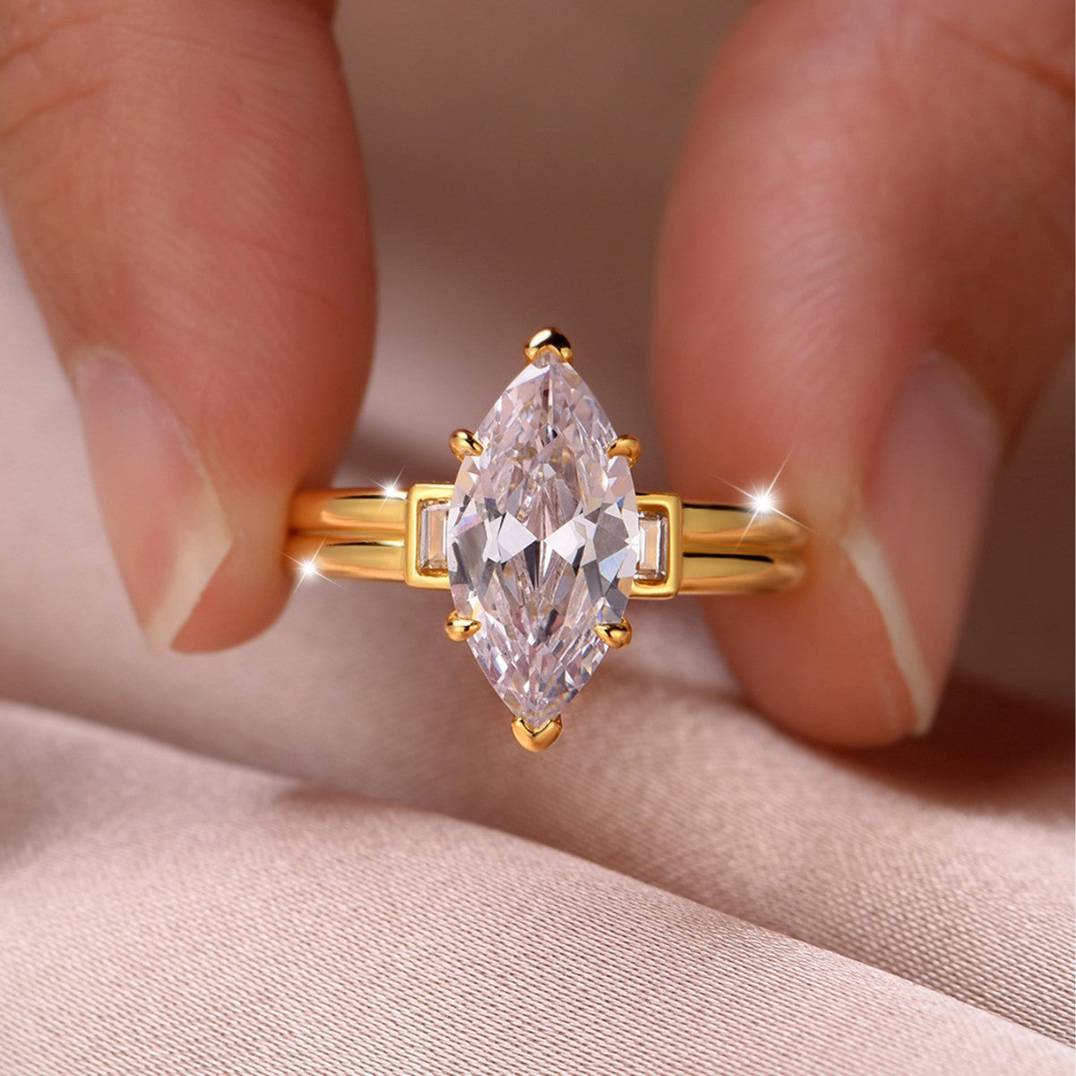 Yellow gold 3CT marquise moissanite ring on soft romantic background. Alt: “3CT Marquise Moissanite Engagement Ring – 18K Yellow Gold.”