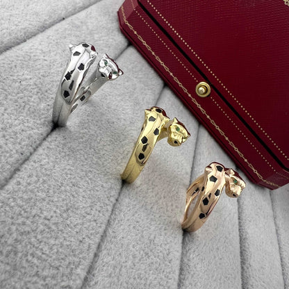 Zerra Jewelry Cartier Panthère de ring narrow model with garnet stones and black lacquer accents, elegant and luxurious jewelry piece.