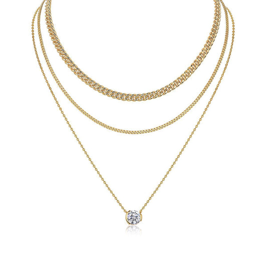 Clean white background — the 3ct bezel set moissanite pendant layered with 2-3 mixed chains on a bust form. The substantial solitaire commands attention, showcasing the round brilliant cut's exceptional fire and brilliance.