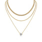Clean white background — the 3ct bezel set moissanite pendant layered with 2-3 mixed chains on a bust form. The substantial solitaire commands attention, showcasing the round brilliant cut’s exceptional fire and brilliance. Chains vary in texture for balanced visual weight.