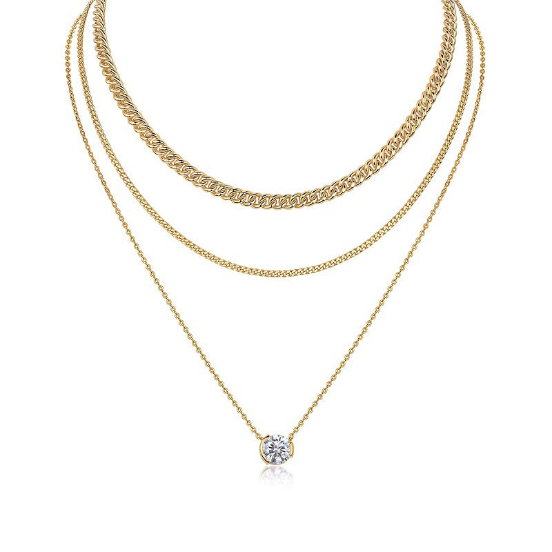 Clean white background — the 3ct bezel set moissanite pendant layered with 2-3 mixed chains on a bust form. The substantial solitaire commands attention, showcasing the round brilliant cut’s exceptional fire and brilliance. Chains vary in texture for balanced visual weight.