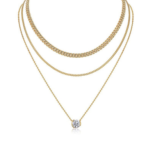 Clean white background — the 3ct bezel set moissanite pendant layered with 2-3 mixed chains on a bust form. The substantial solitaire commands attention, showcasing the round brilliant cut’s exceptional fire and brilliance. Chains vary in texture for balanced visual weight.