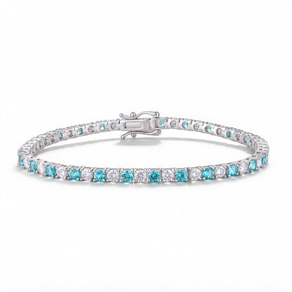 3.0mm lab grown paraiba tourmaline and moissanite tennis bracelet in sterling silver isolated on white background