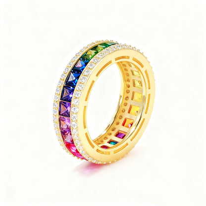 Gold 3mm princess cut rainbow channel-set eternity band ring with pave borders on white studio background