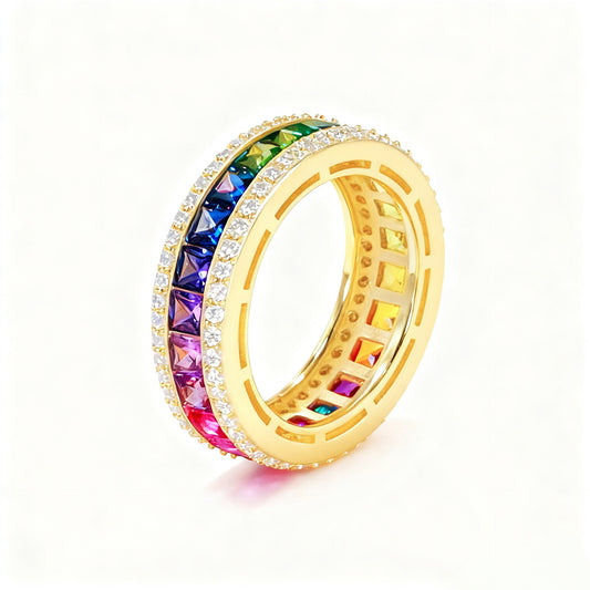 Gold 3mm princess cut rainbow channel-set eternity band ring with pave borders on white studio background