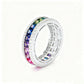 Silver 3mm princess cut rainbow channel-set eternity band ring with pave borders on white studio background