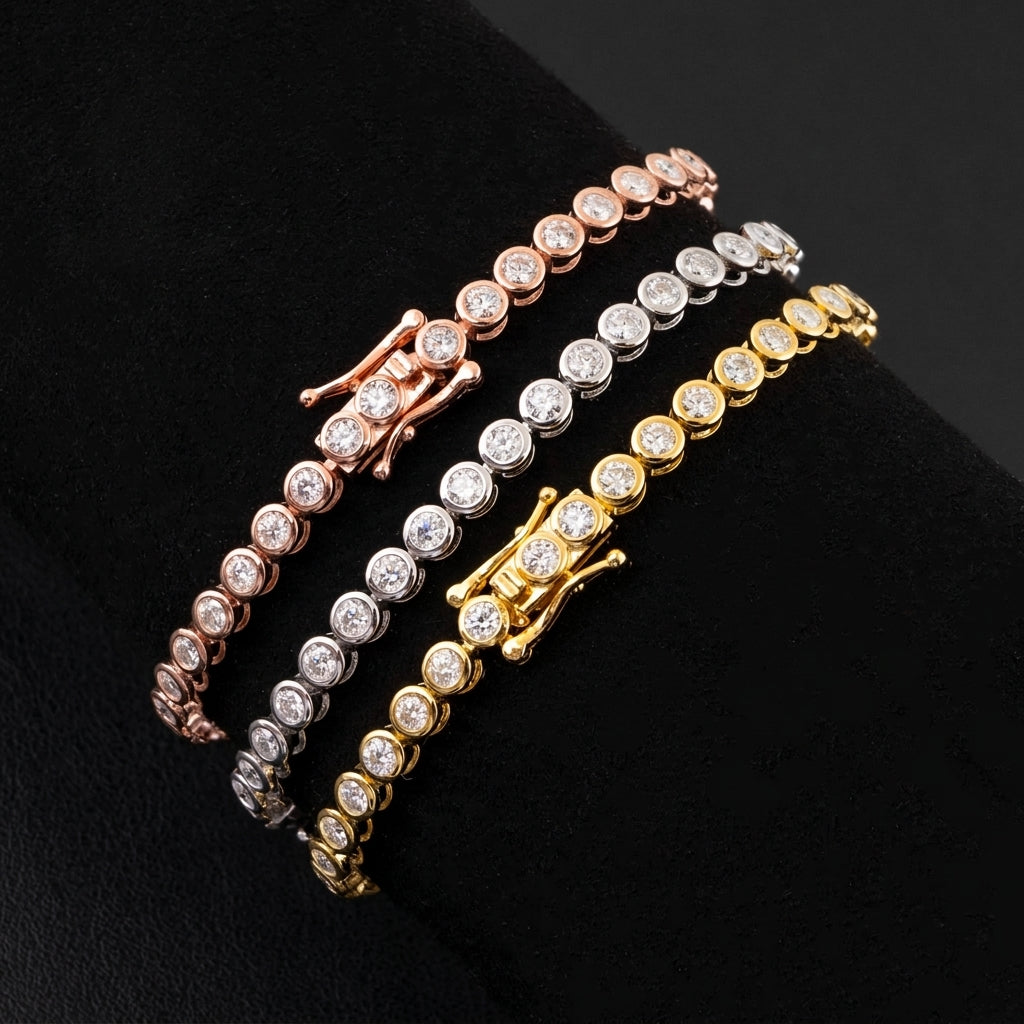 Three tennis-style bracelets with round clear stones and decorative clasp details, shown in rose gold, silver, and yellow gold on a black background.