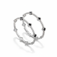 Pair of silver bracelets with black gemstones on a white background