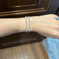 Female model wearing the bracelet on wrist.