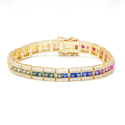 Gold 3x3mm princess cut rainbow channel-set tennis bracelet with pave borders and box clasp on white background
