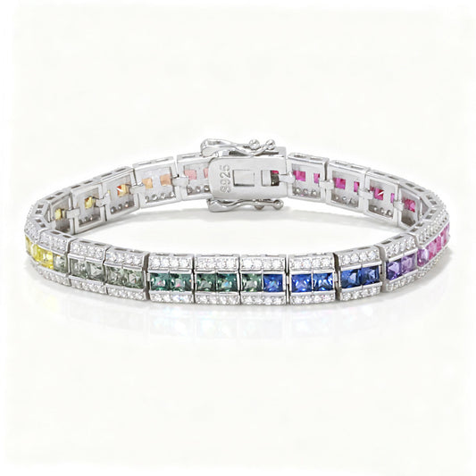 Silver 3x3mm princess cut rainbow channel-set tennis bracelet with pave borders on white background