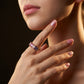 Model wearing gold 3x5mm emerald cut rainbow gemstone eternity band ring on hand