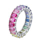 Silver 3x5mm emerald cut rainbow eternity band ring with multi-color gemstones isolated on white studio background