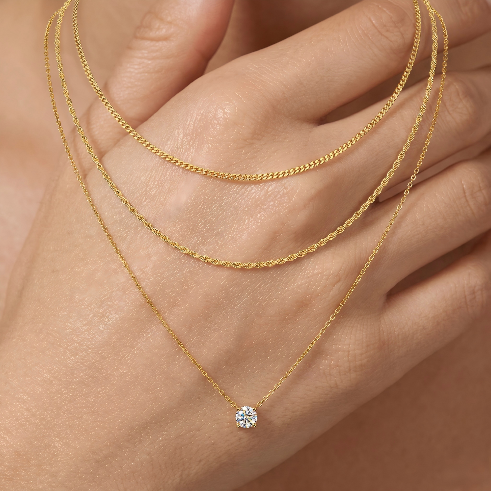 Macro, necklace draped across female hand, natural curve, warm soft light, mirror metal shine, sharp sparkle, blurred skin background, detailed texture, intimate luxury feel.